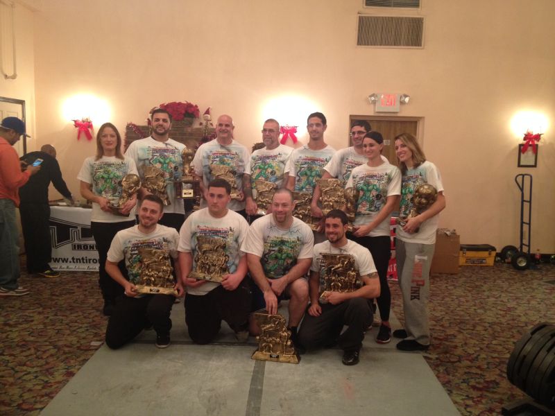 The Missing Link Powerlifting Team captures first place. Photo of the Missing Link Powerlifting Team. Kneeling L-R James Gisondi, Mario Barbagallo, Jeff Deigan, Nick Gisondi; standing L-R Judy Demuro, Vito Cirioni, Peter Gisondi Jr., Anthony Gisondi Sr., Peter Gisondi III, Gino Gisondi, Salina Gisondi, Clarissa Gisondi.
 